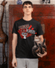 bella canvas t shirt mockup of a serious man carrying an adorable kitty m34768 scaled