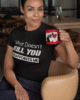 t shirt mockup of a woman sitting on a chair holding an 11 oz coffee mug 31705