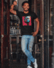 copy of heathered tee mockup of a man standing at a bar s entrance 34985 r el2 1