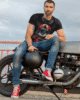 t shirt mockup featuring a tattooed man sitting on a motorbike m10263 r el2